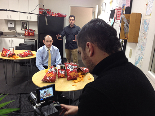 Brett Friedman (left), Richard Webb (middle), and Eric Haviv (right) frame up a breakroom shot