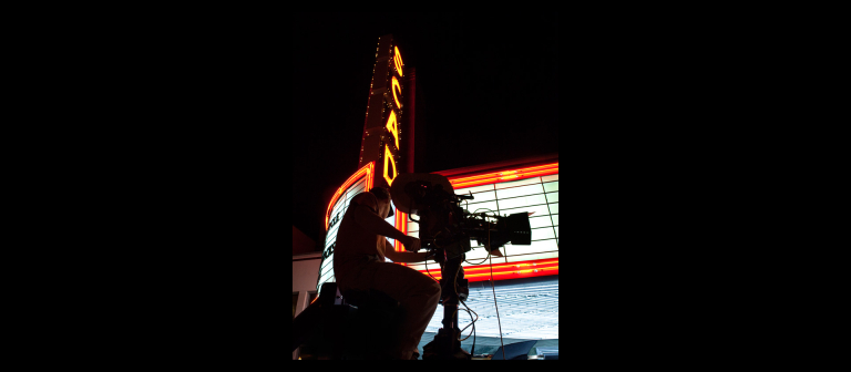 Television camera in front of marquee Television camera in front of marquee