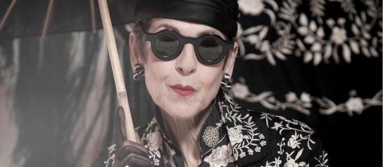 Black and white photo of style icon Tziporah Salamon with parasol