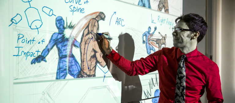 SCAD professor demonstrates drawing techniques on white board