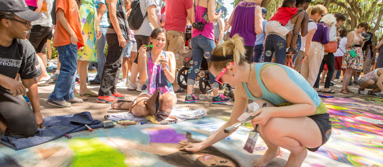 SCAD students creating chalk designs at Sidewalk Arts Festival SCAD students creating chalk designs at Sidewalk Arts Festival in Forsyth Park