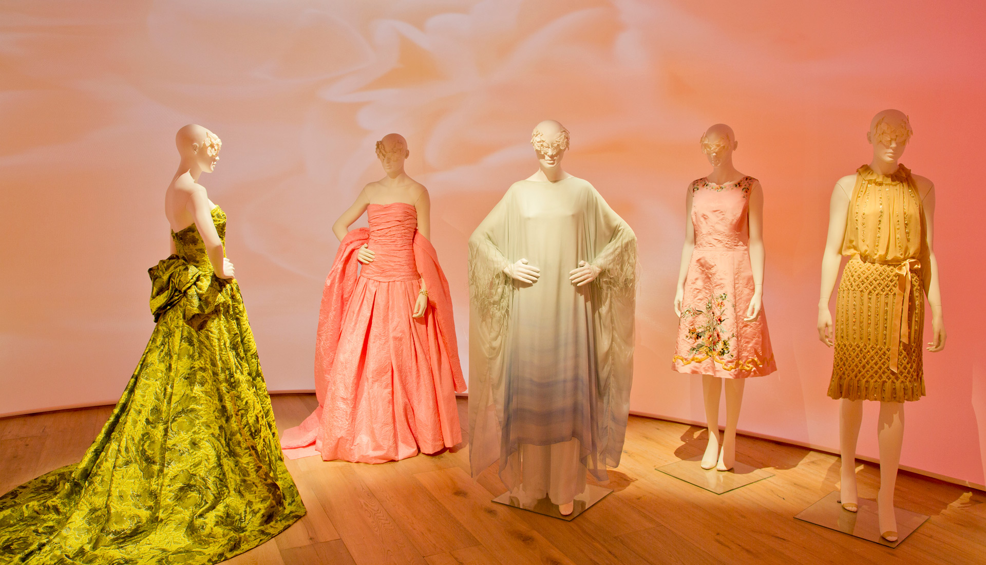 Three dresses on mannequins at SCAD FASH Museum in Atlanta