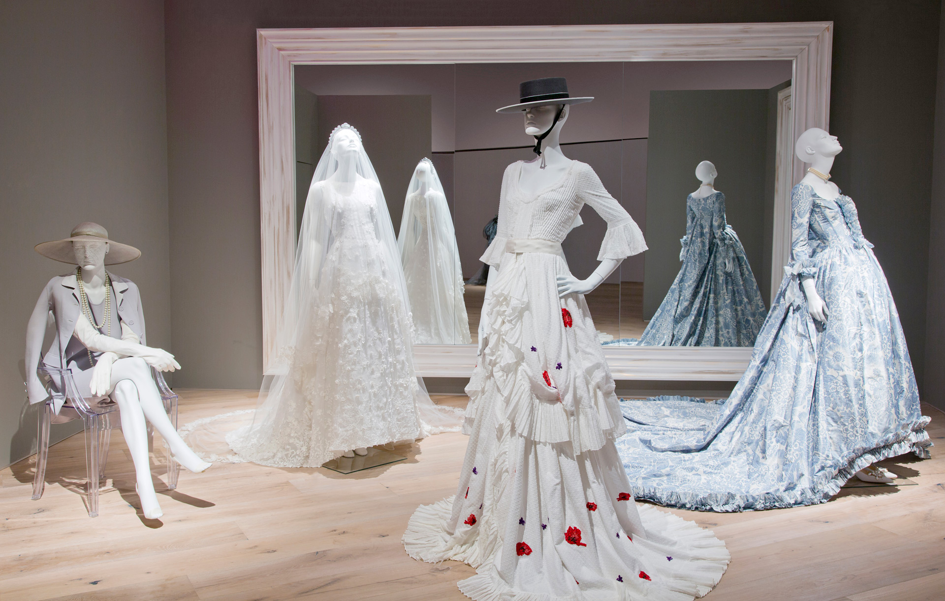 Three mannequins in dresses at the SCAD FASH Museum in Atlanta