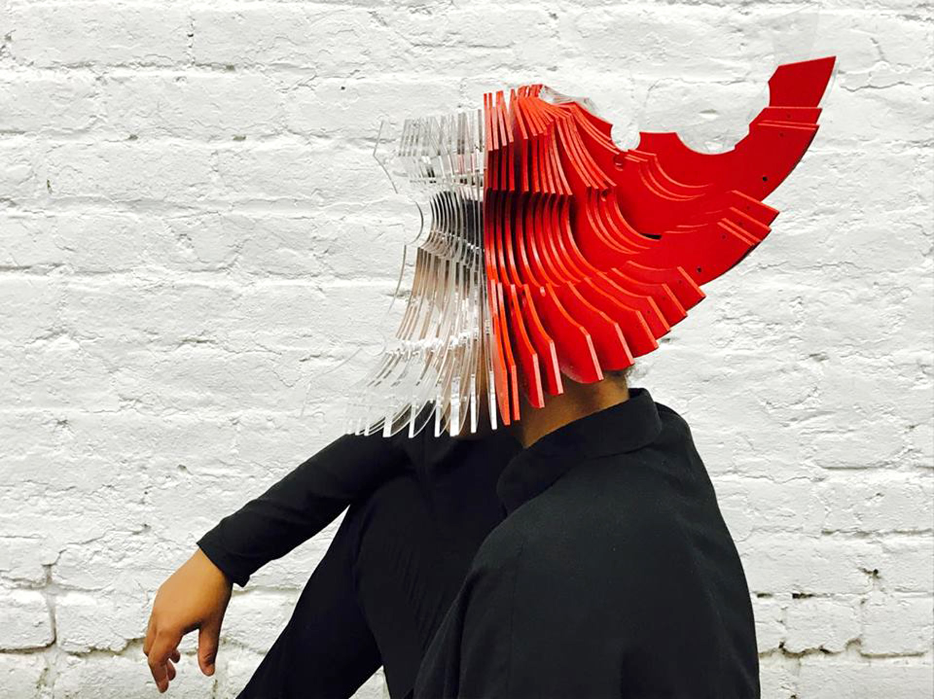 Abstract hat with layers of red and translucent panels