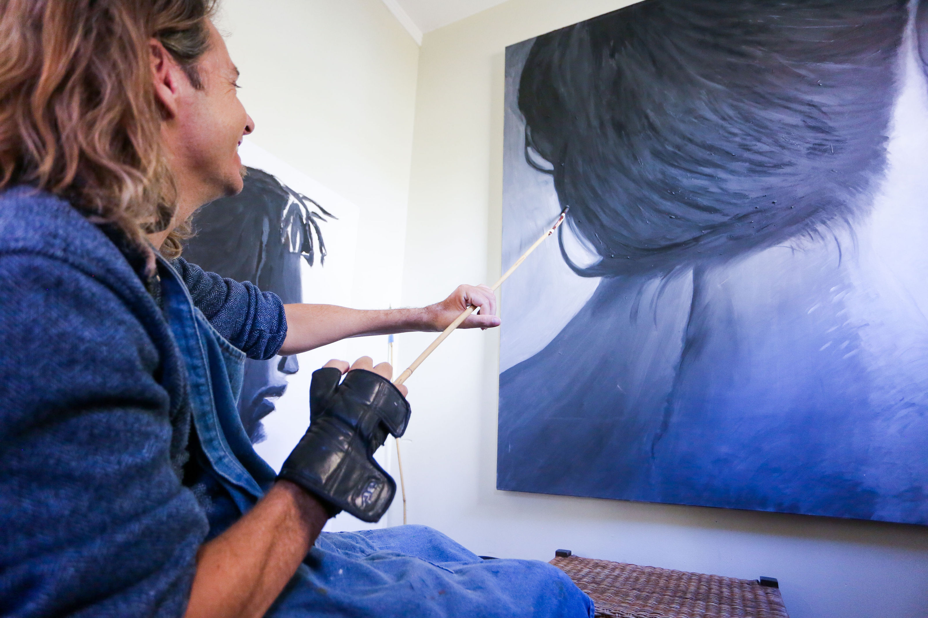 David McCauley painting in the studio