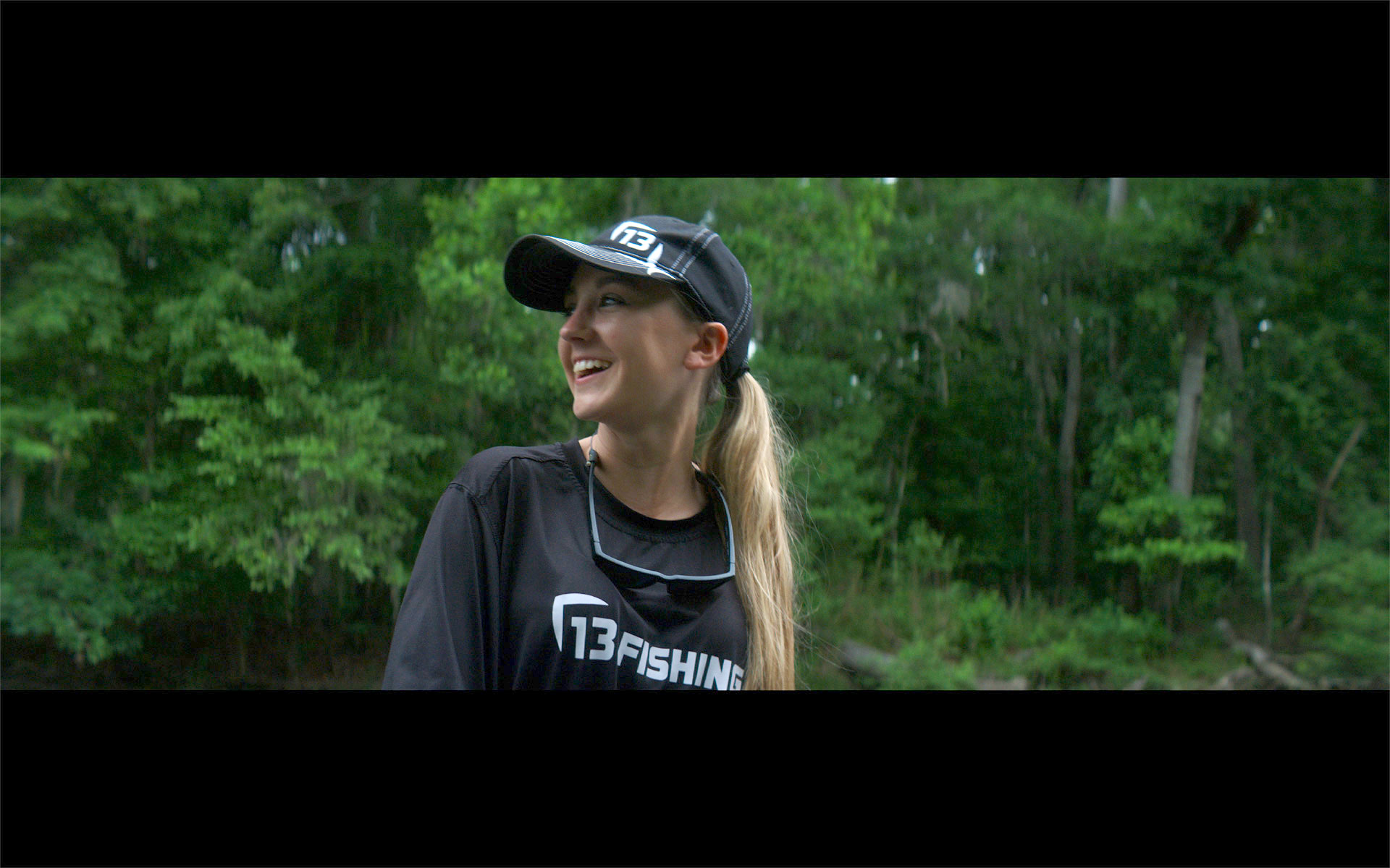 Still of woman wearing a fishing shirt