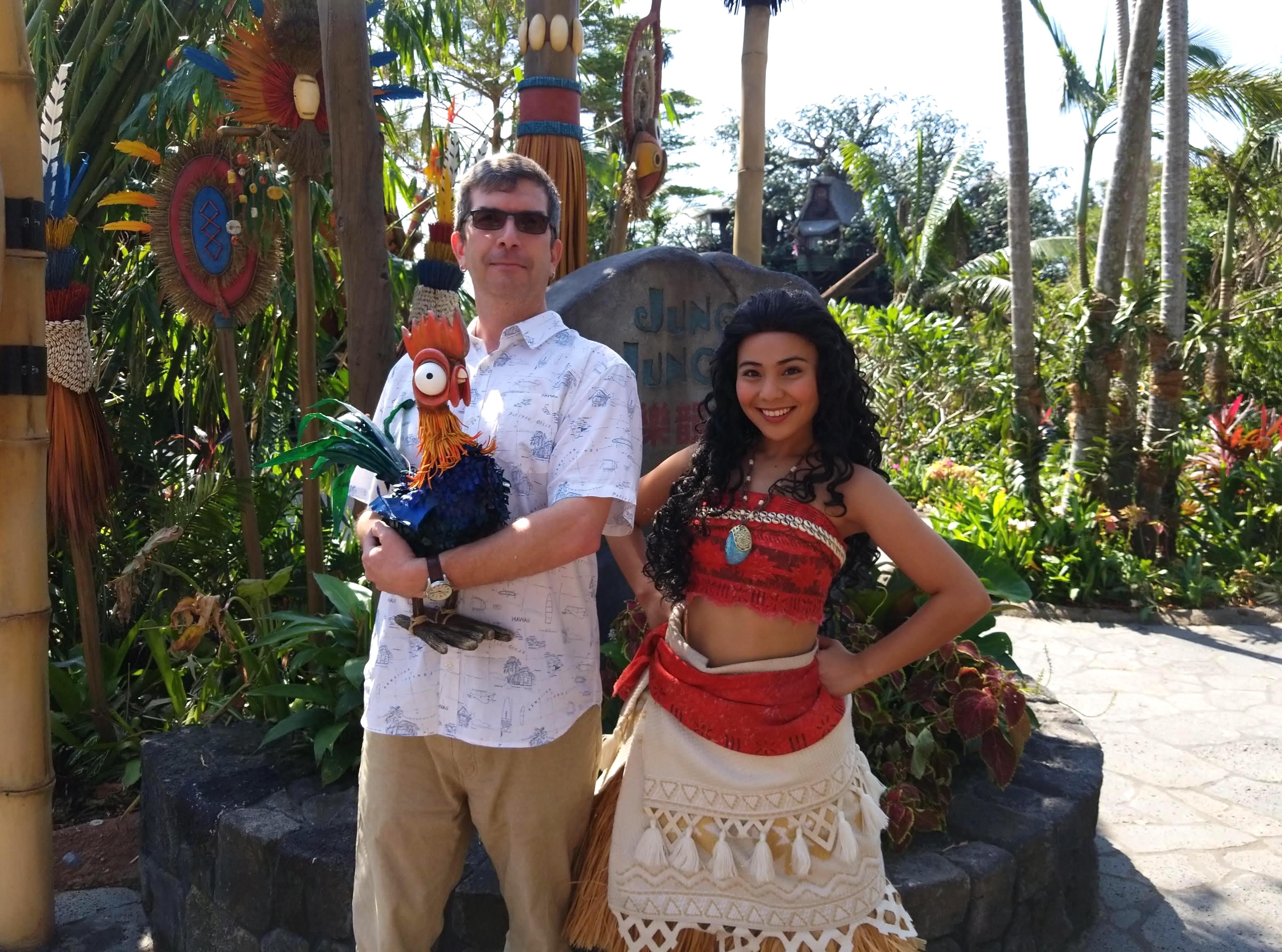  Hobbie cuddles rooster Heihei with Moana's approval