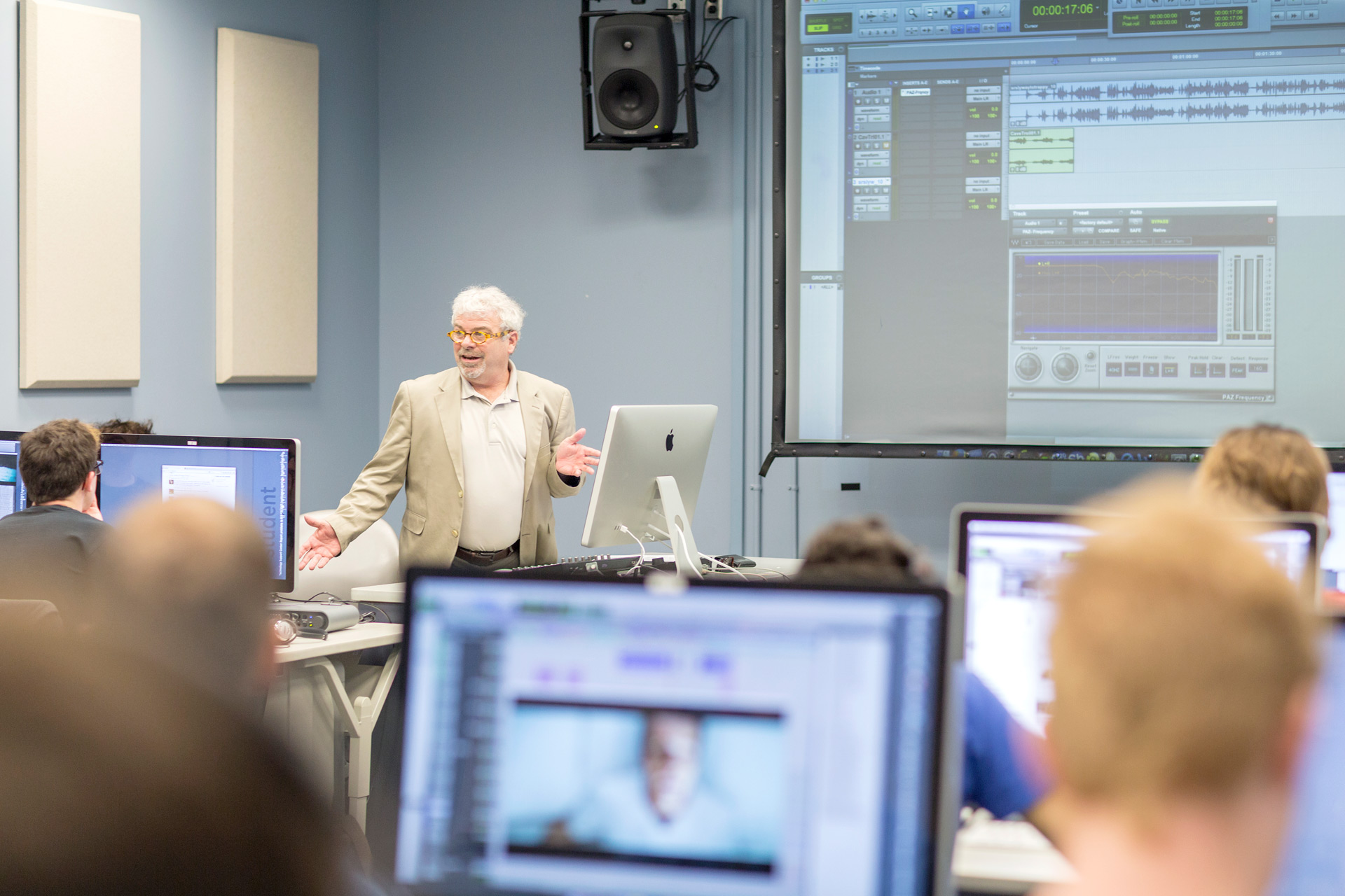 LeGrand lectures in the front of a computer lab