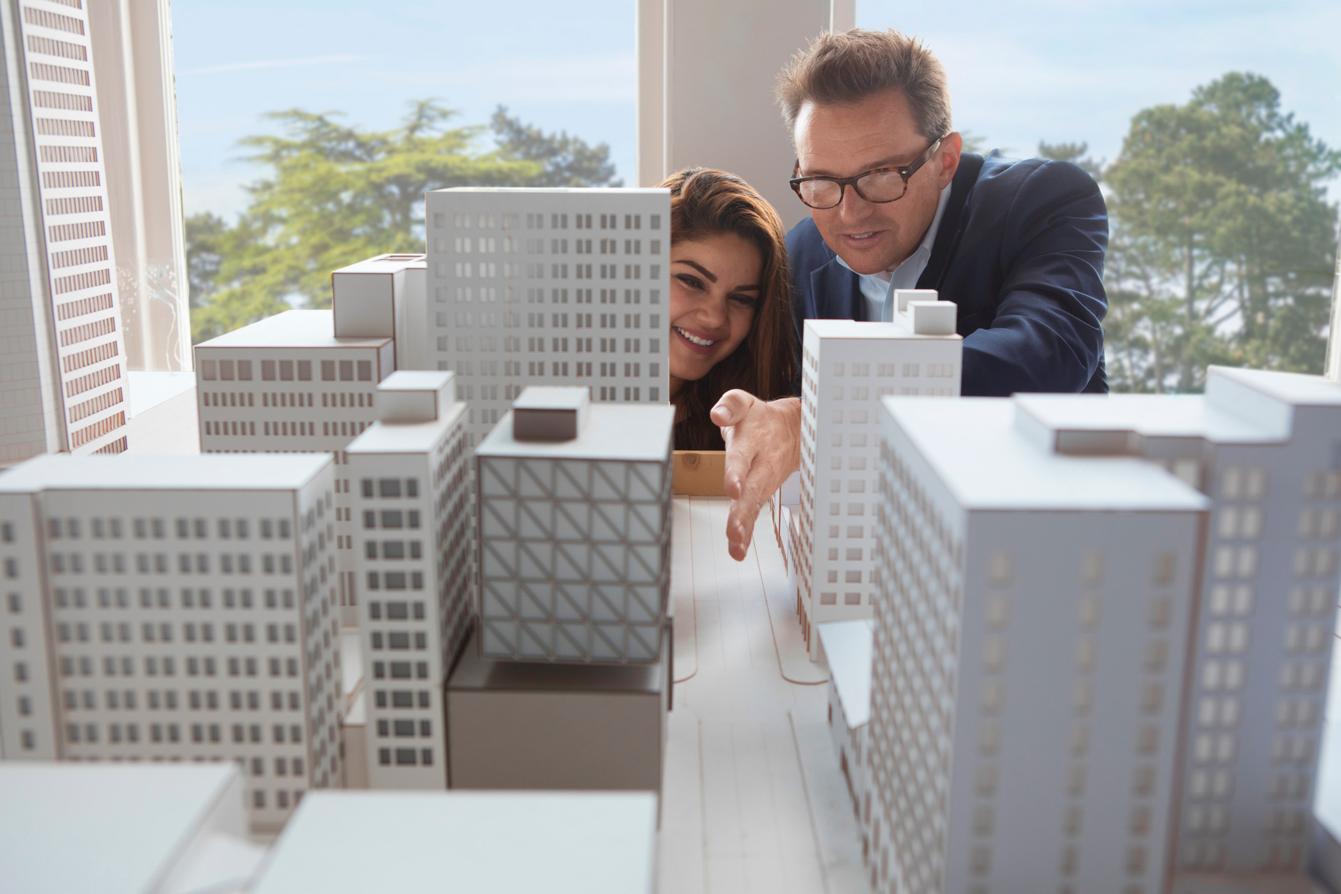 Urban design student and professor examine a model