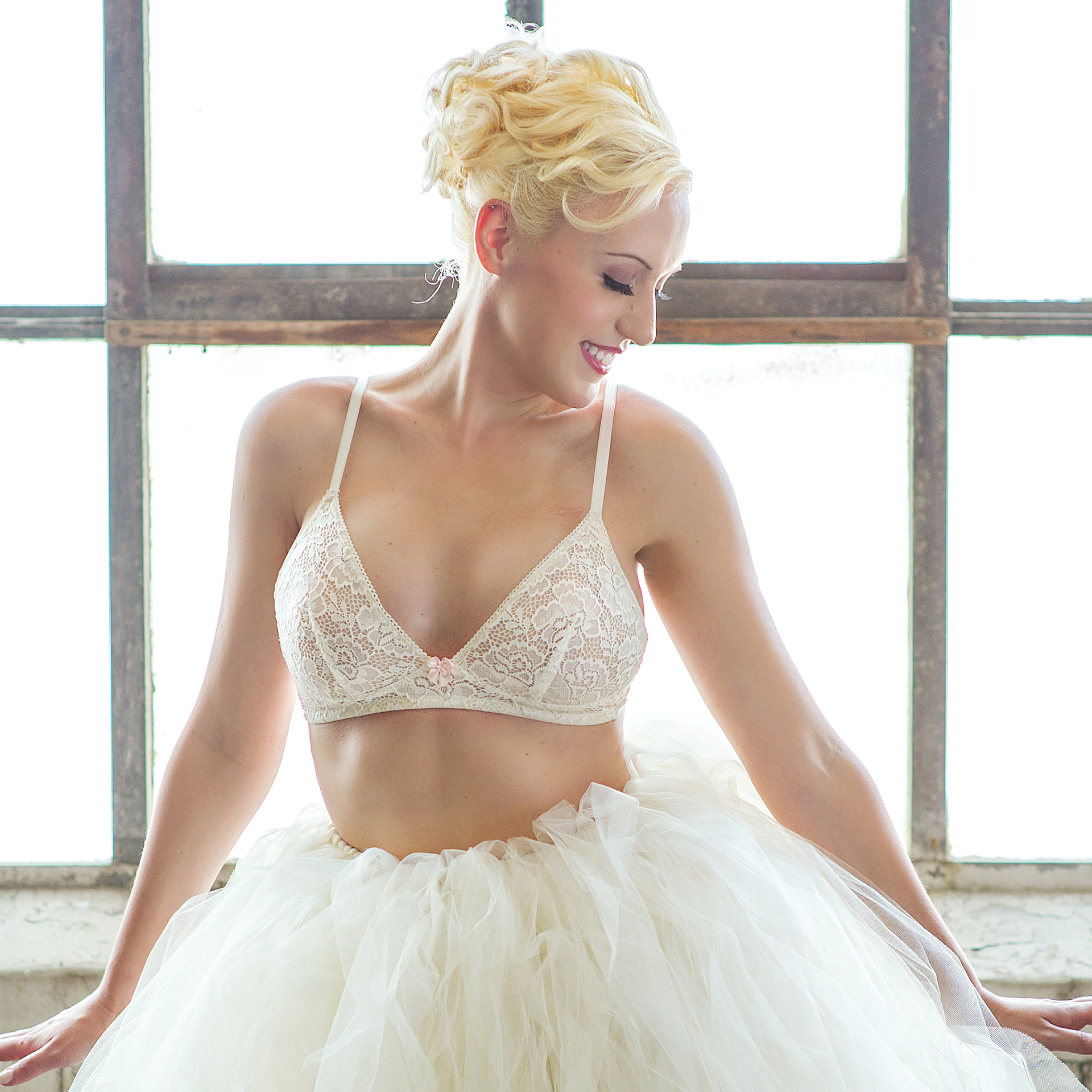 Model in white lace bra