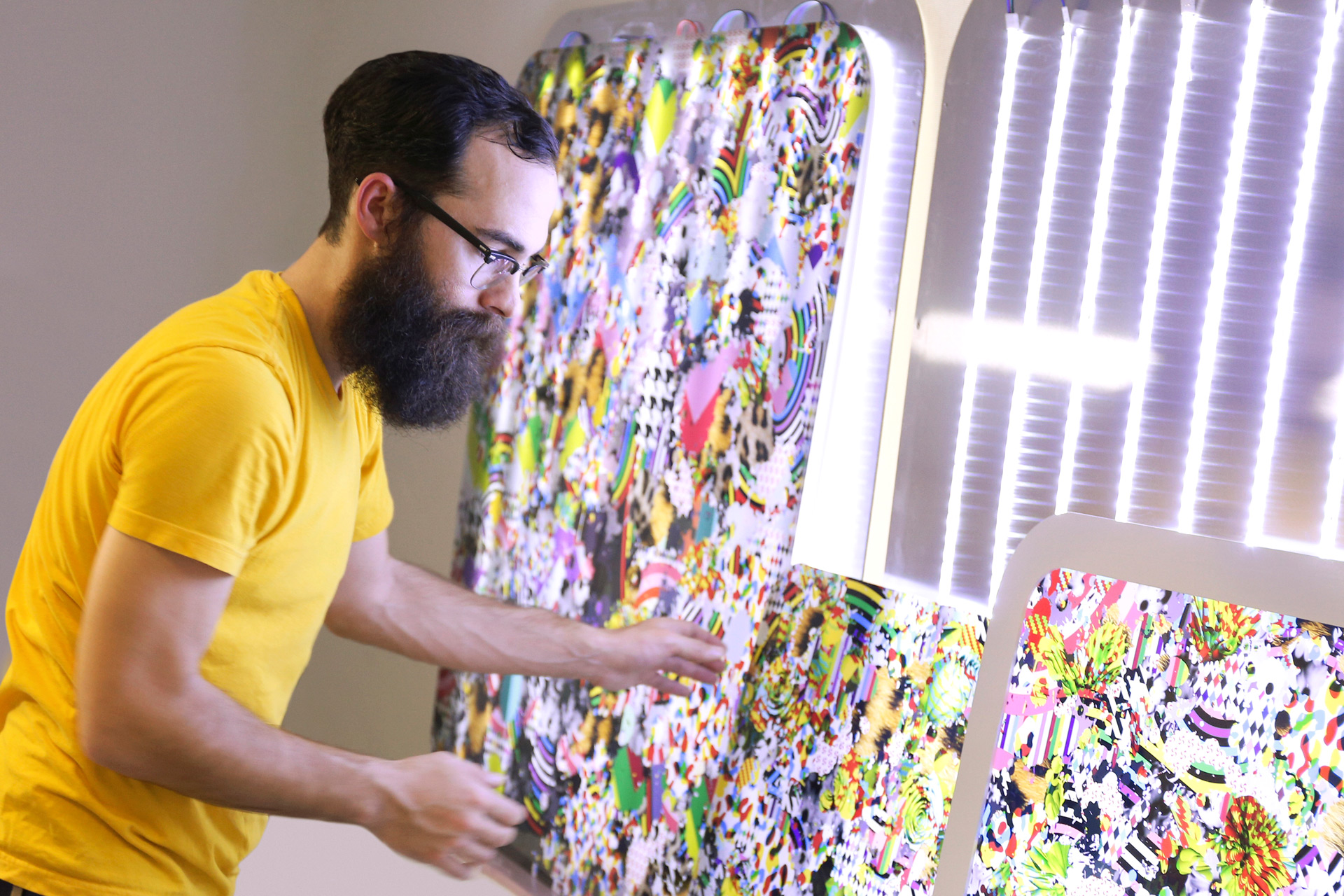 SCAD graduate Michael Porten assembles his backlit artwork for Art Central, Hong Kong