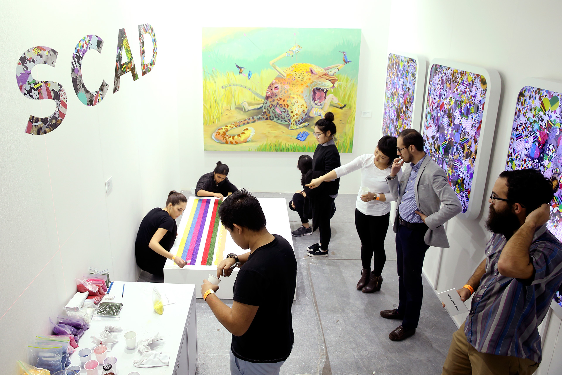 SCAD alumni work to assemble their booth at Art Central in Hong Kong