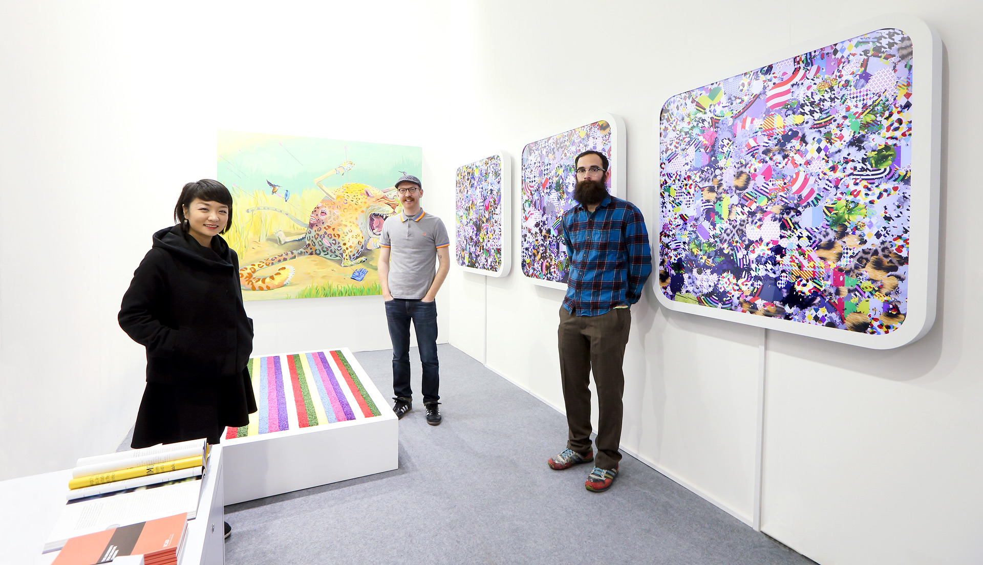 SCAD alumni stand next to work at Art Central Hong Kong