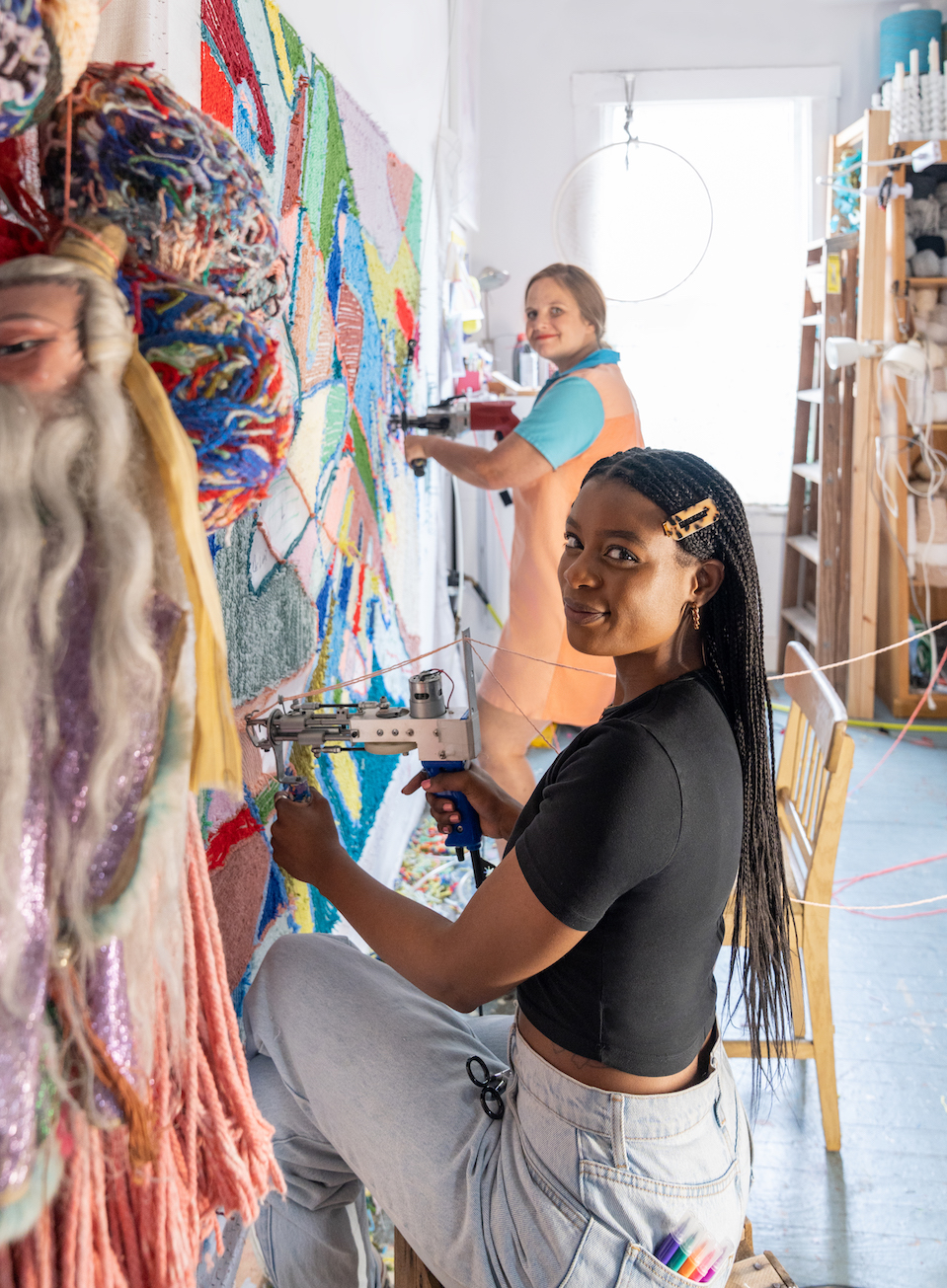 Aliyah Salmon and Trish Andersen create Handled with Care, mixed yarns, 2022.
