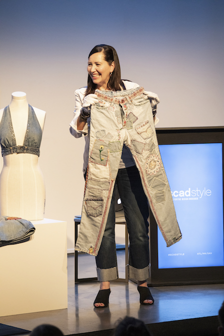 Woman holding a pair of Levi's jeans