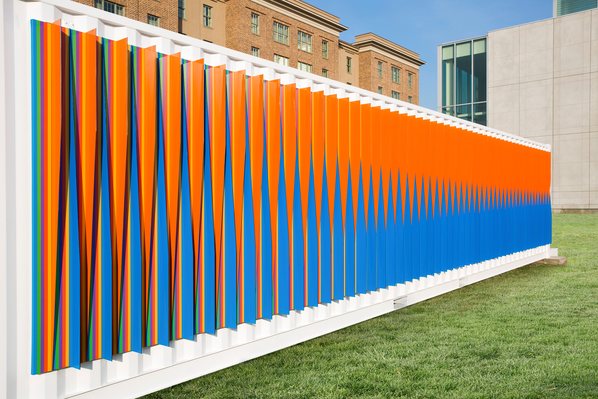 Bright orange and blue stripes on outdoor wall