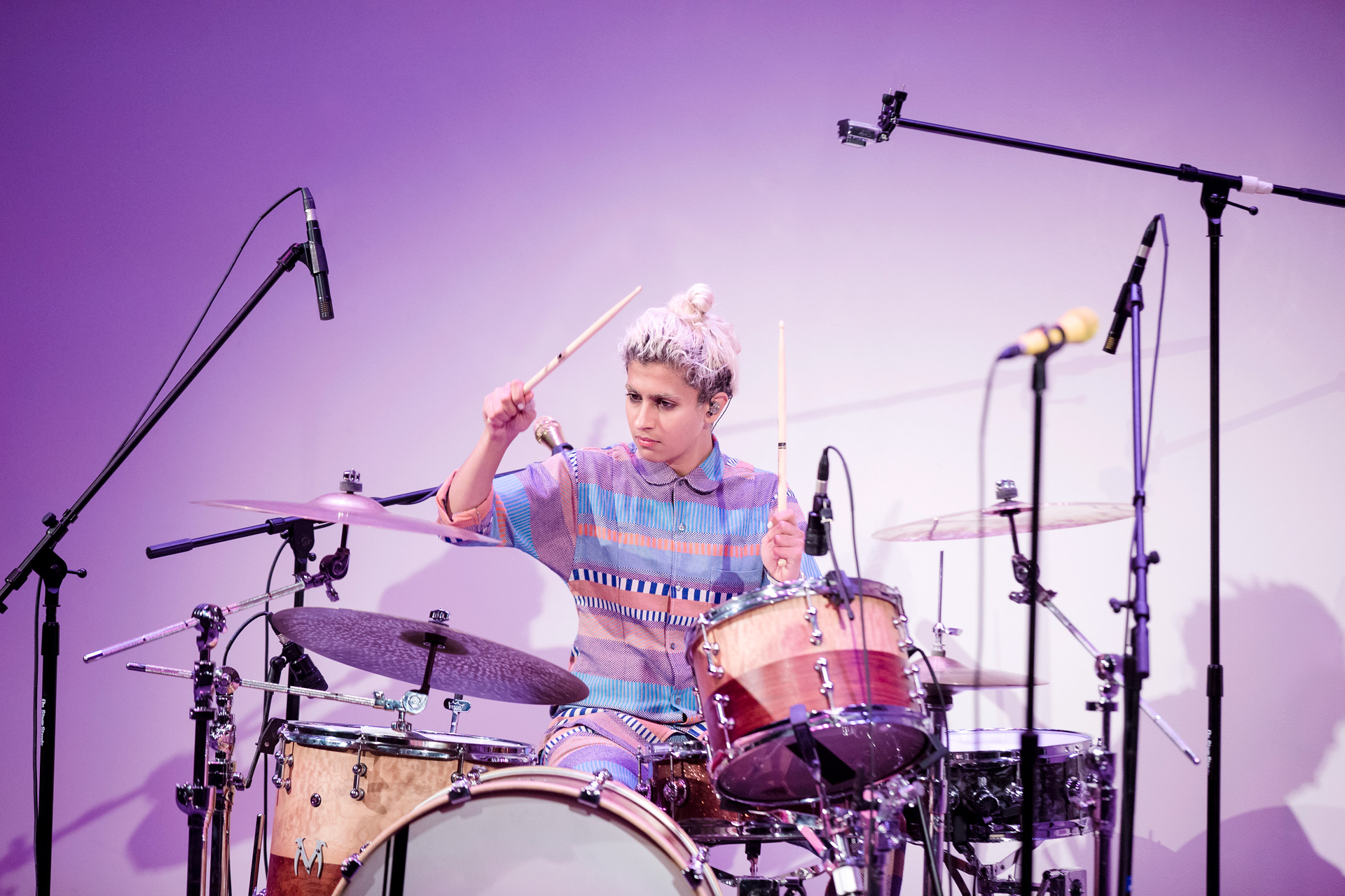 Madame Gandhi plays the drums at theater inside the SCAD Museum of Art