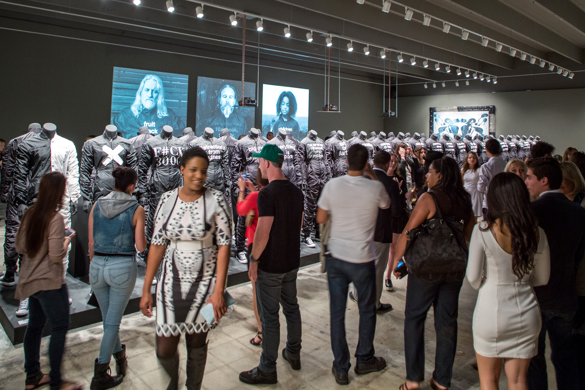 Visitors take photos at exhibition i feel ya
