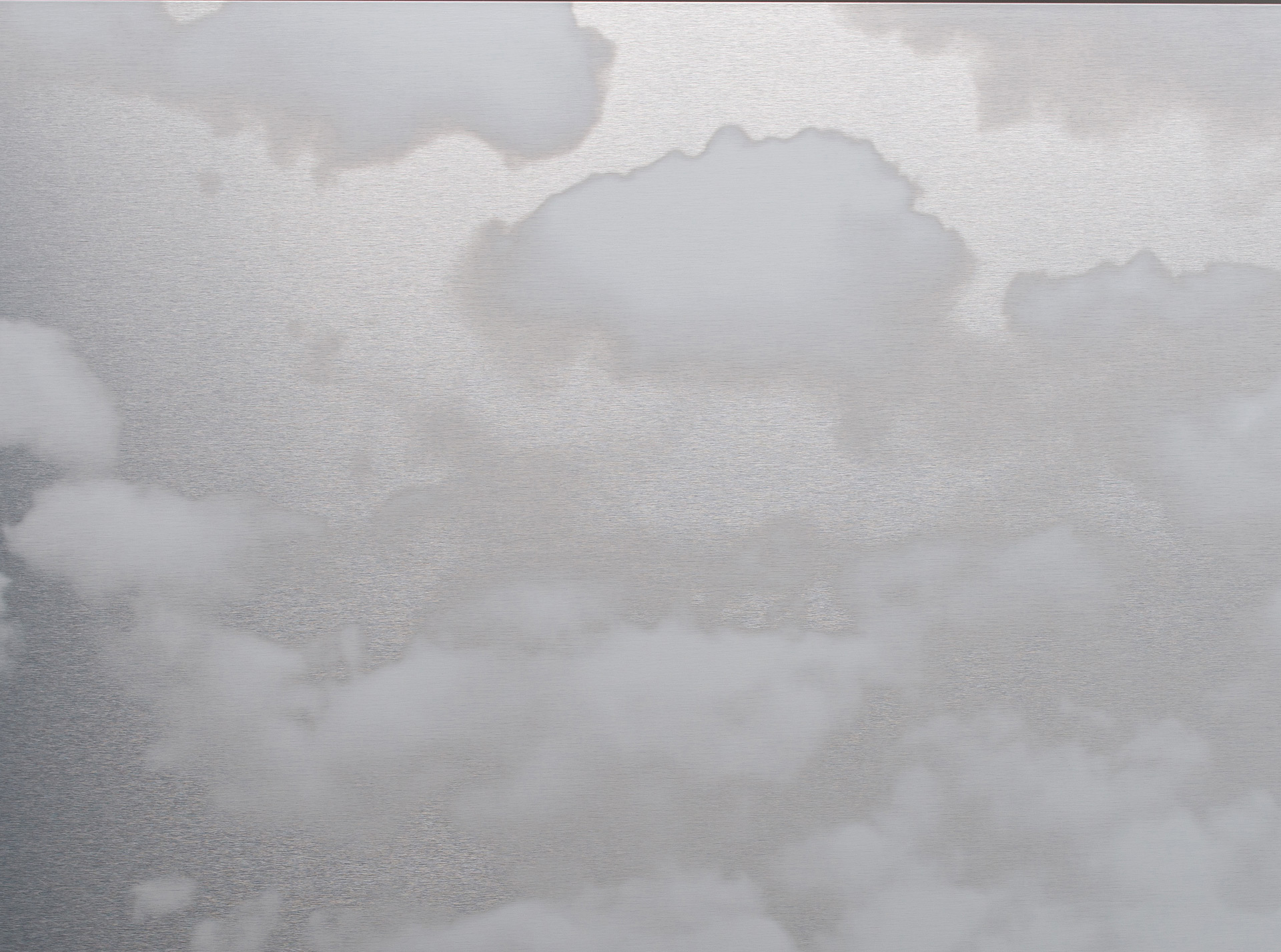 White clouds float against a steely gray background