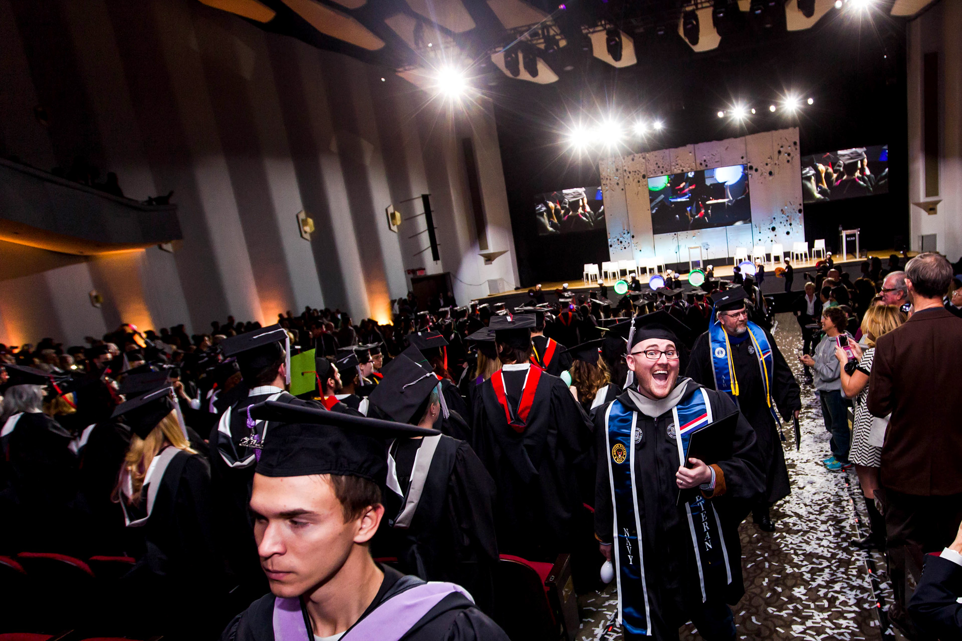 Graduates funnel out of building