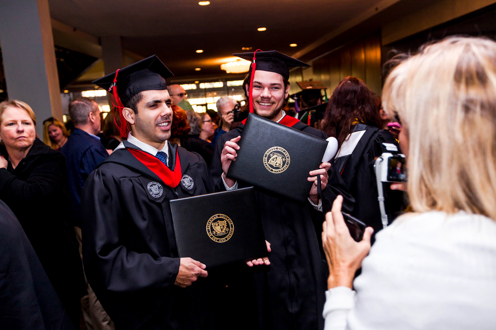 Graduates show off their diplomas