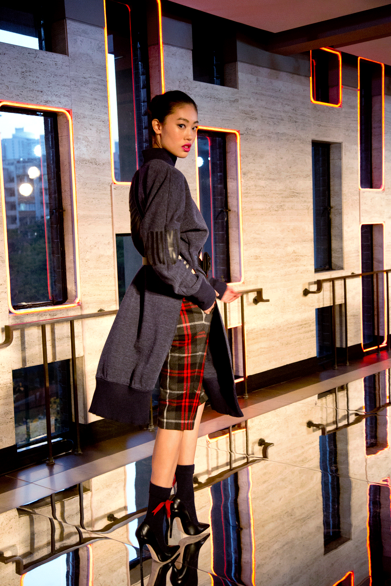 Model wears plaid skirt on Hong Kong runway