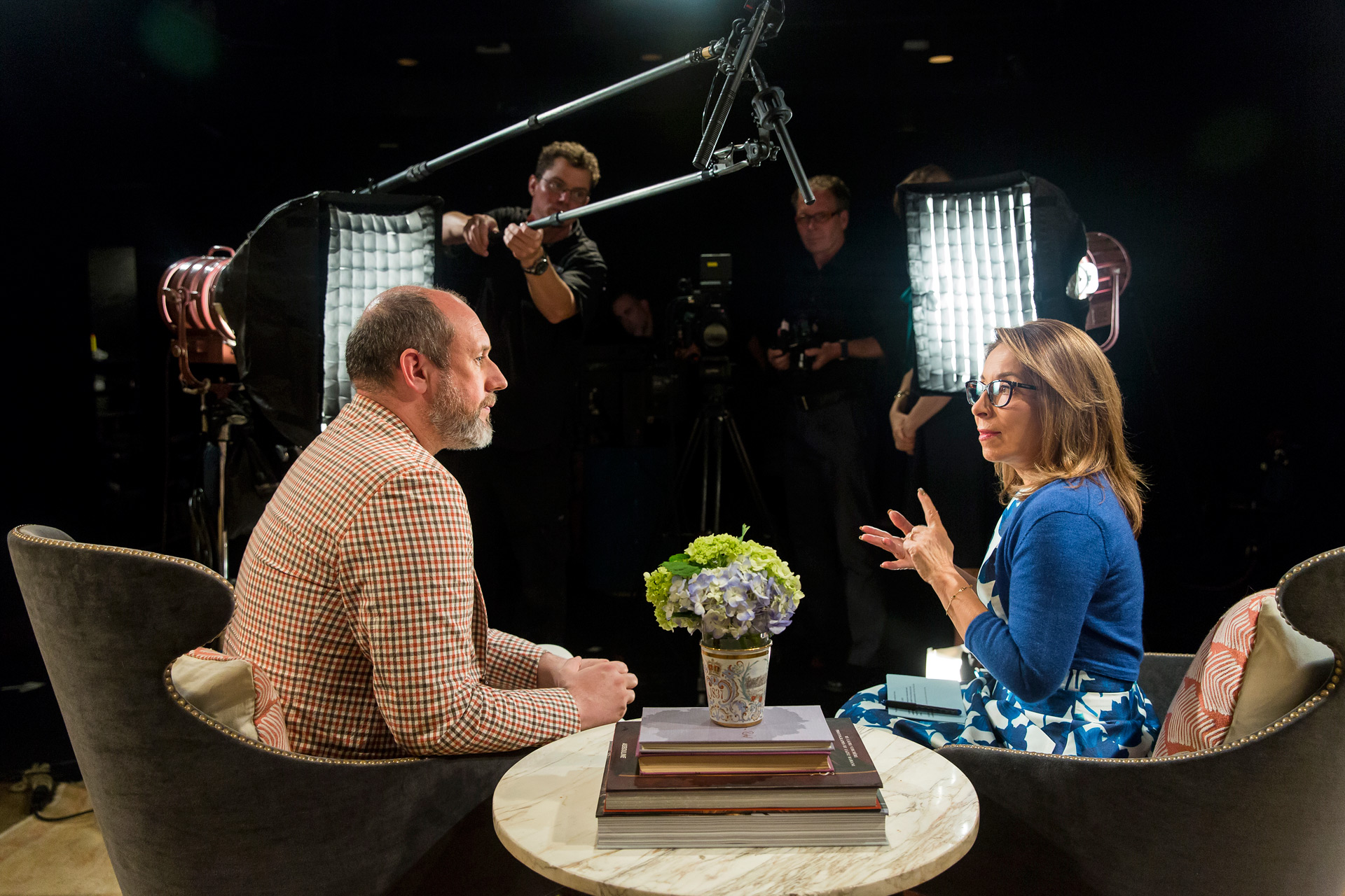 SCAD president Paula Wallace interviews Peter Copping in front of film crew