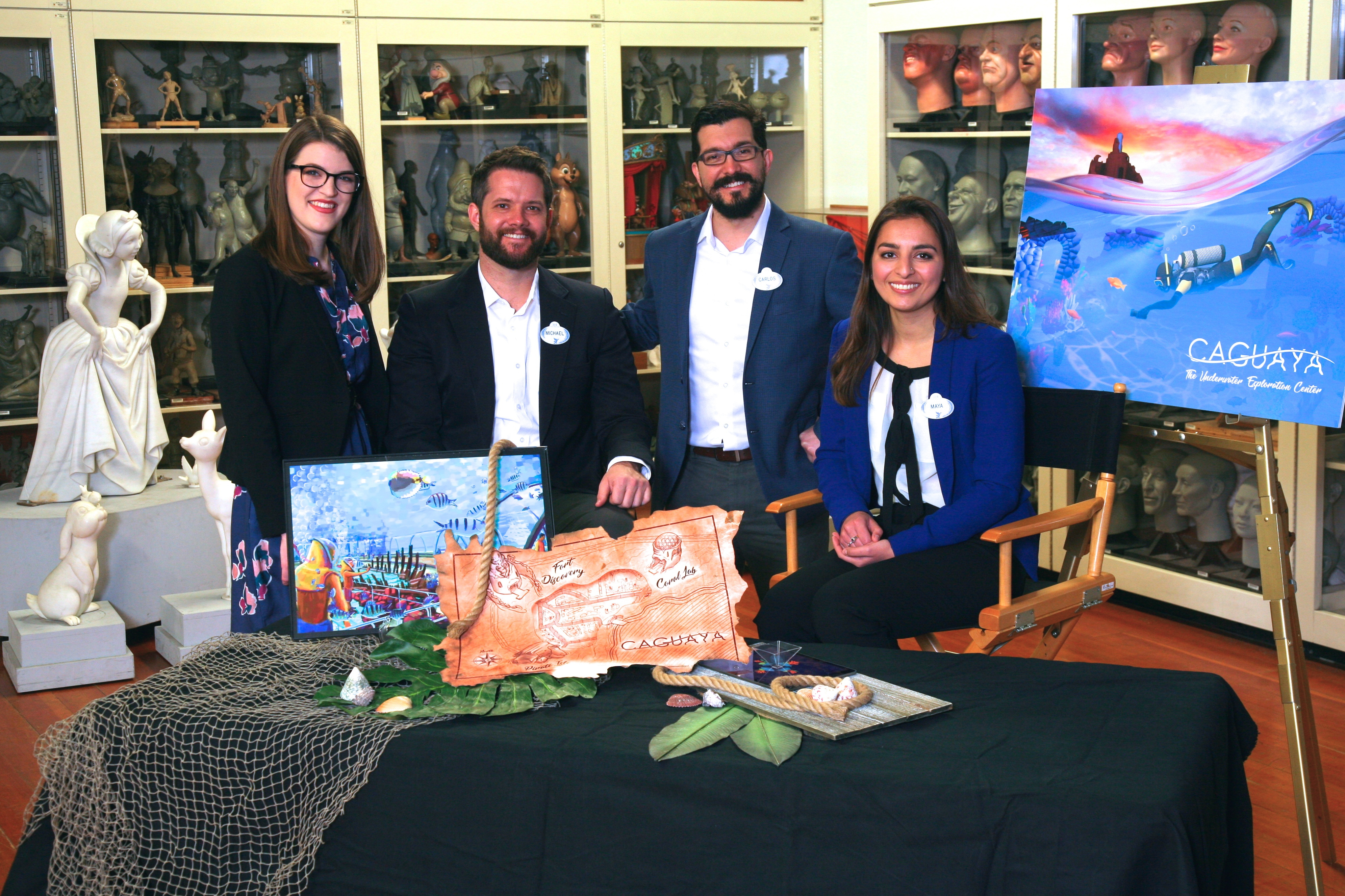 Students show their winning project Caguaya displayed on a table