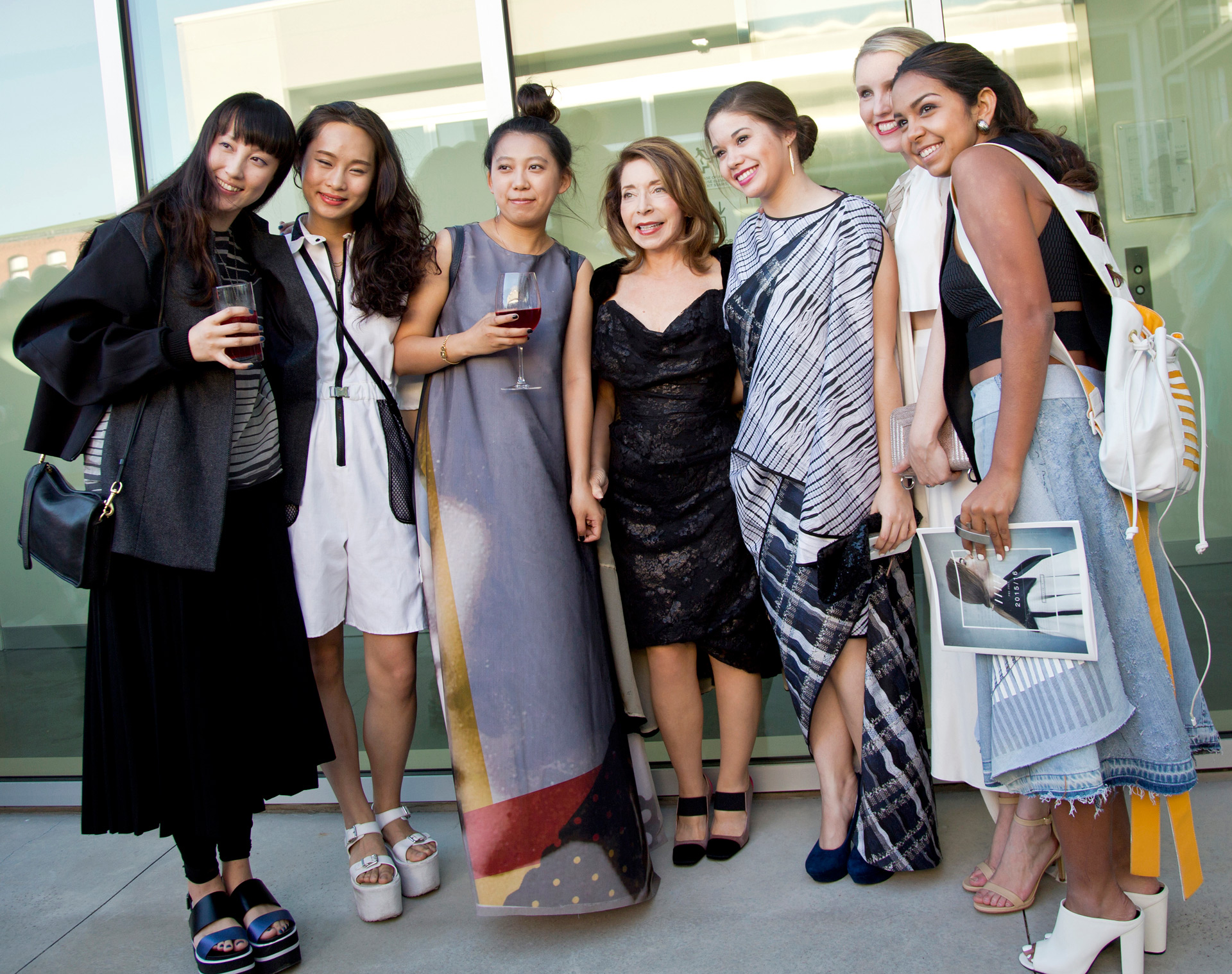 Student designers pose with SCAD president Paula Wallace
