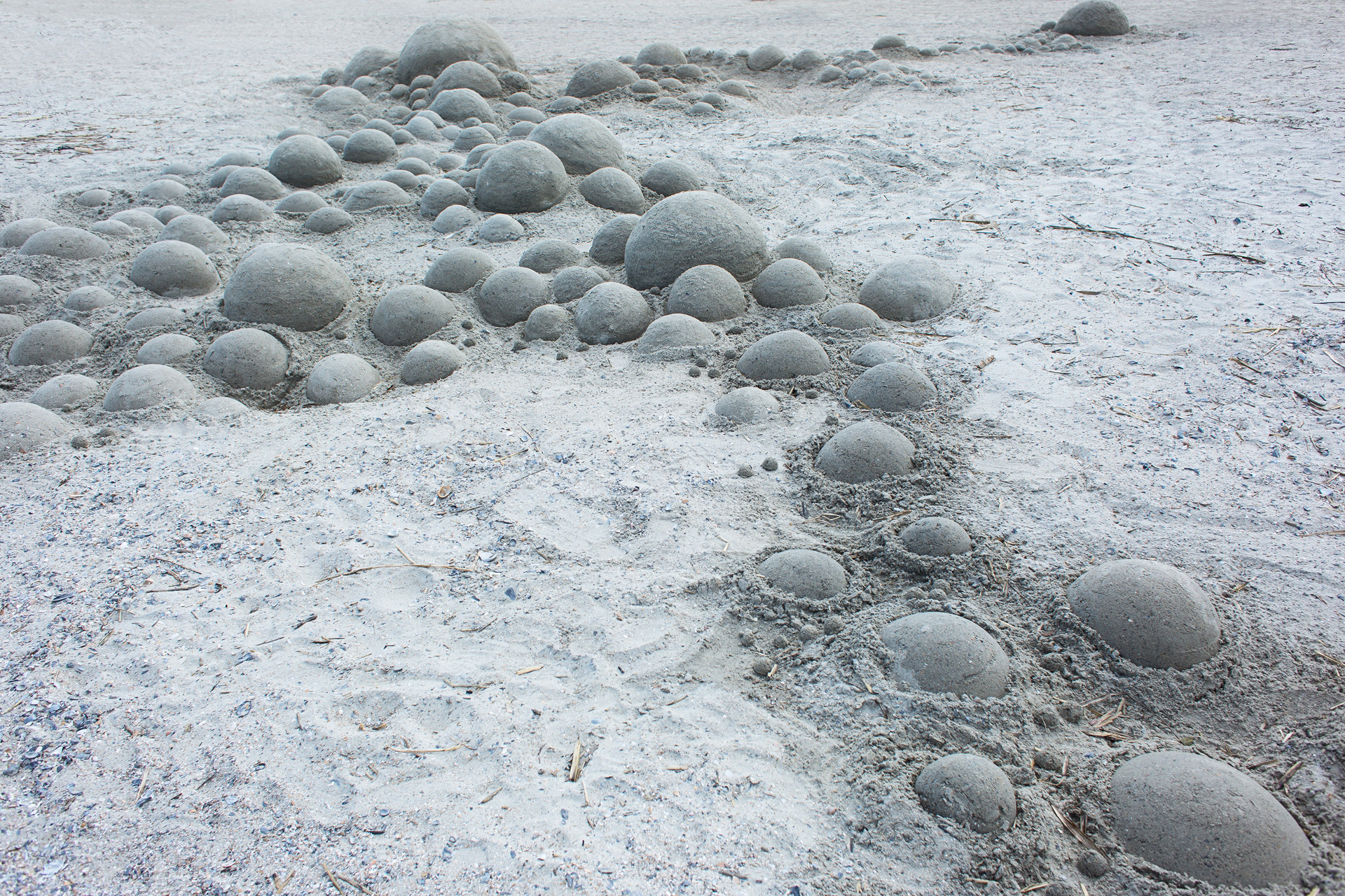 Series of round bubbles sculpted in sand