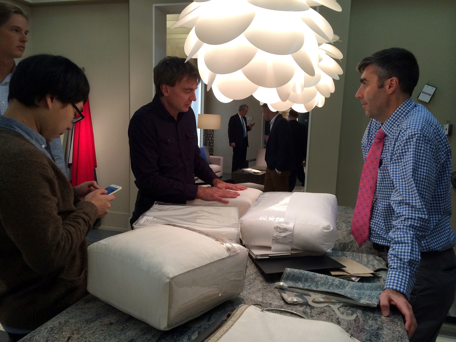 Students and professors examine cushions