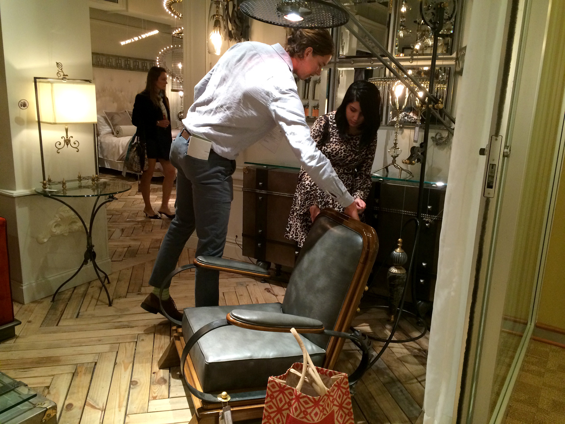 Students examine chair in showroom