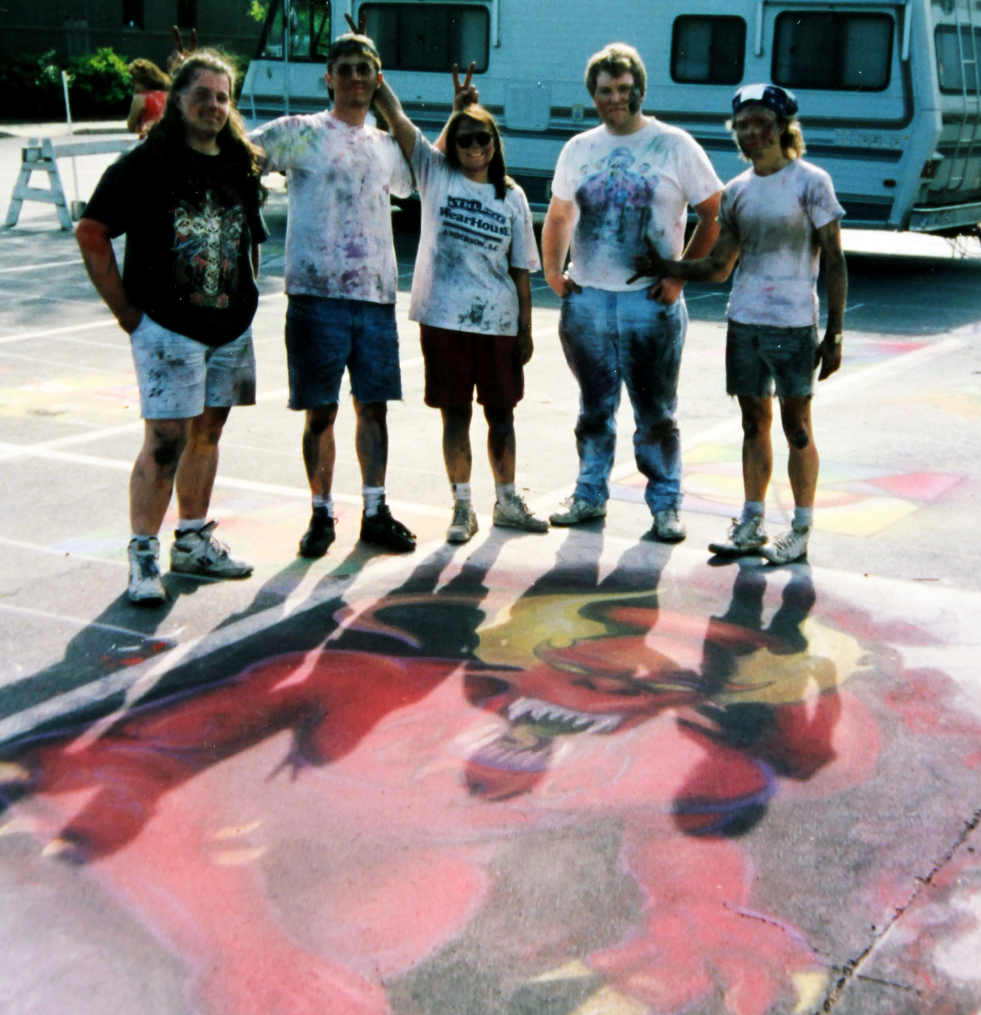 Students stand over their work at the 1993 Sidewalk Arts Festival