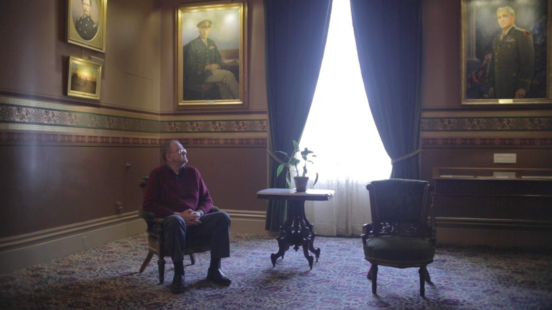 Still of man sitting in large room from the movie State of Marriage