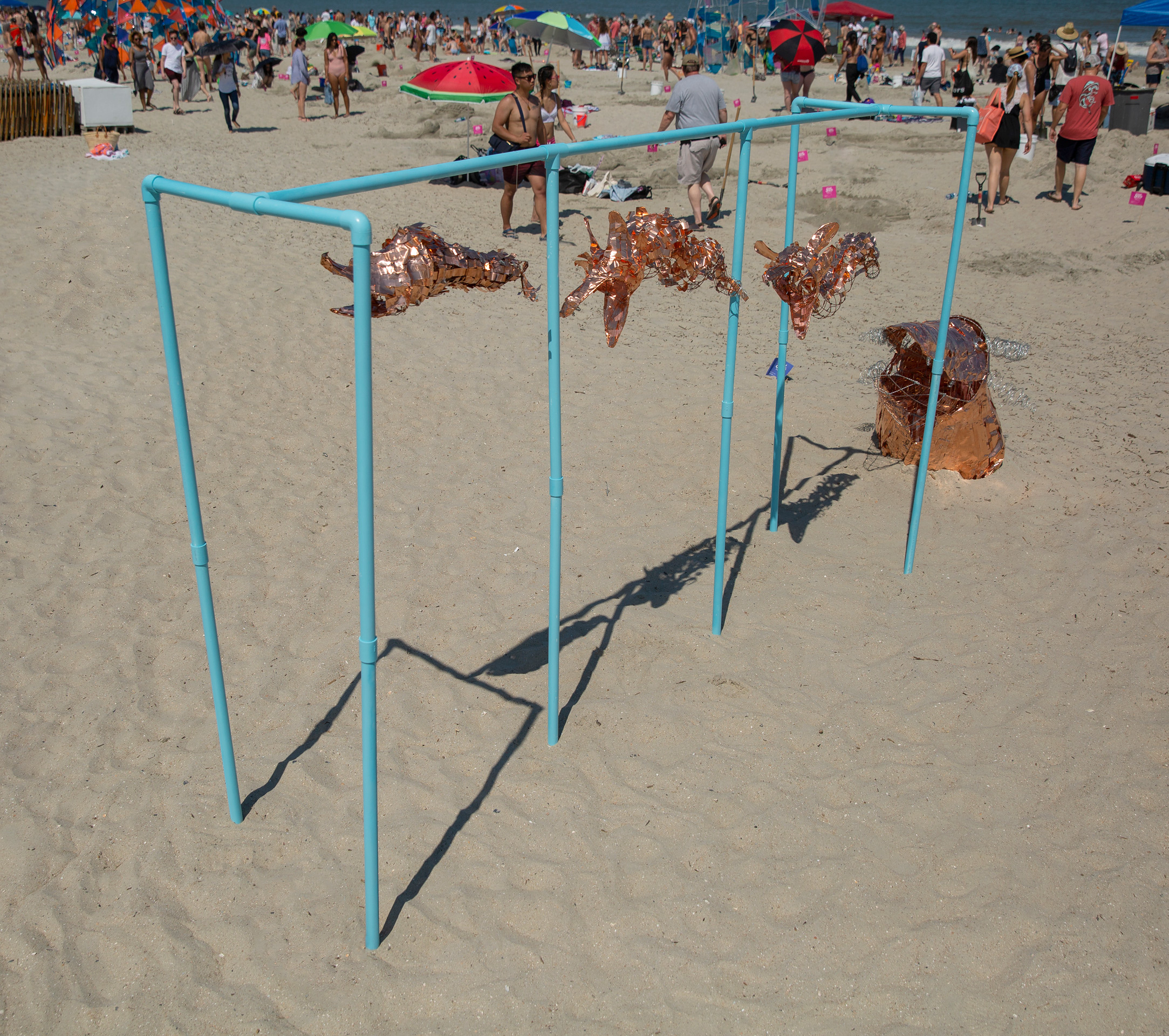 Wind sculpture with four bronze figures
