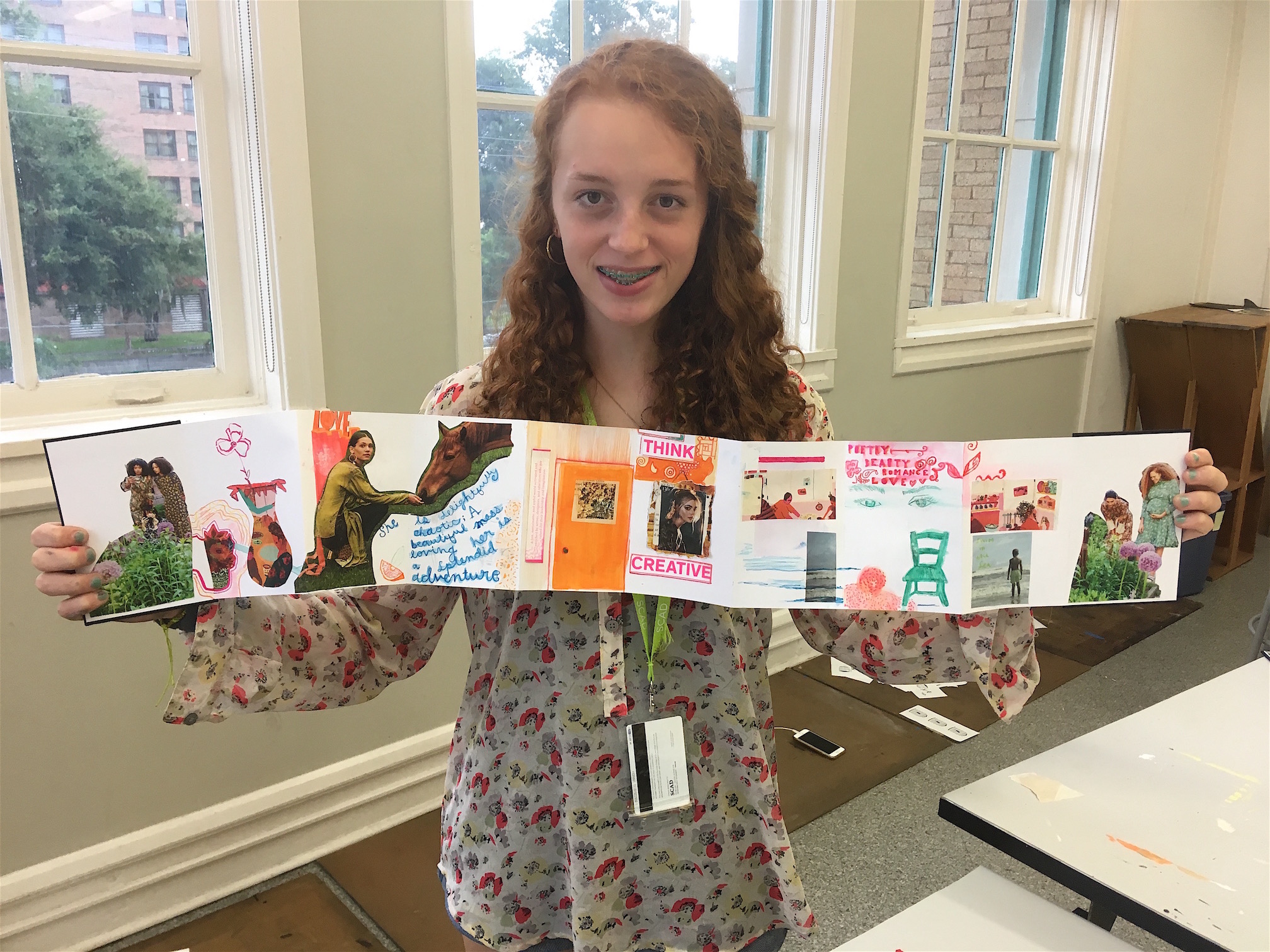 Student shows off large collage