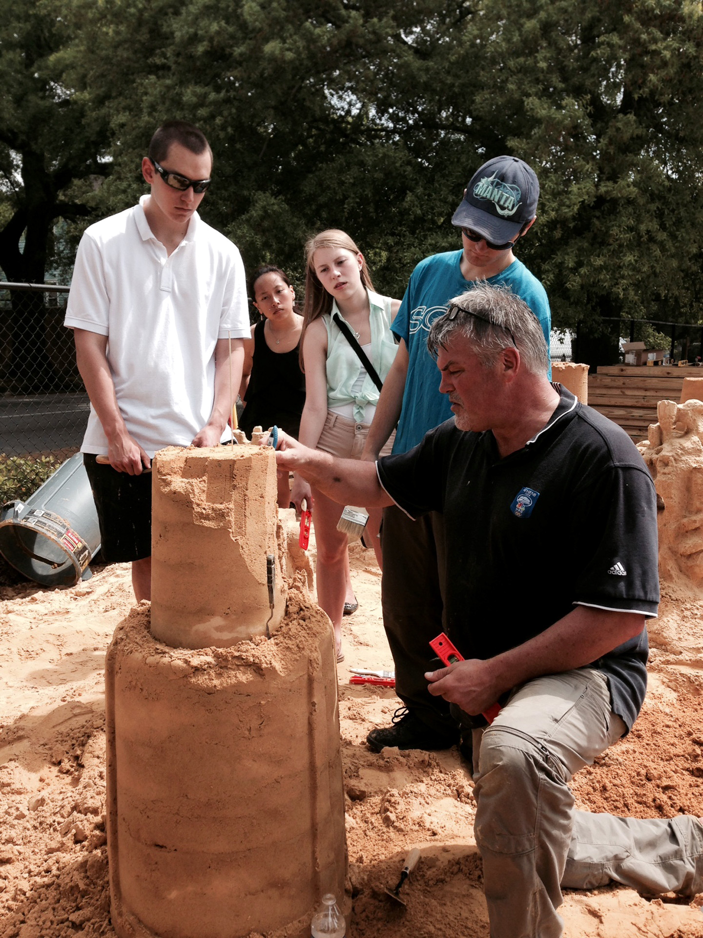  Ted Siebert demonstrates sand sculpting techniques to SCAD students