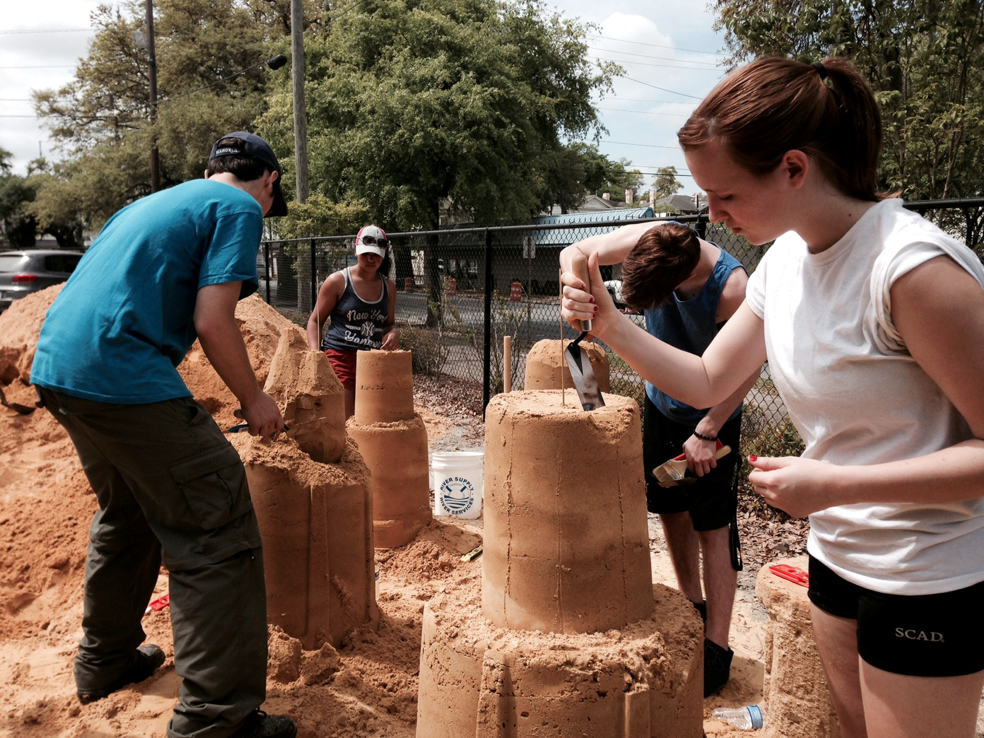 SCAD students work on sand sculpture