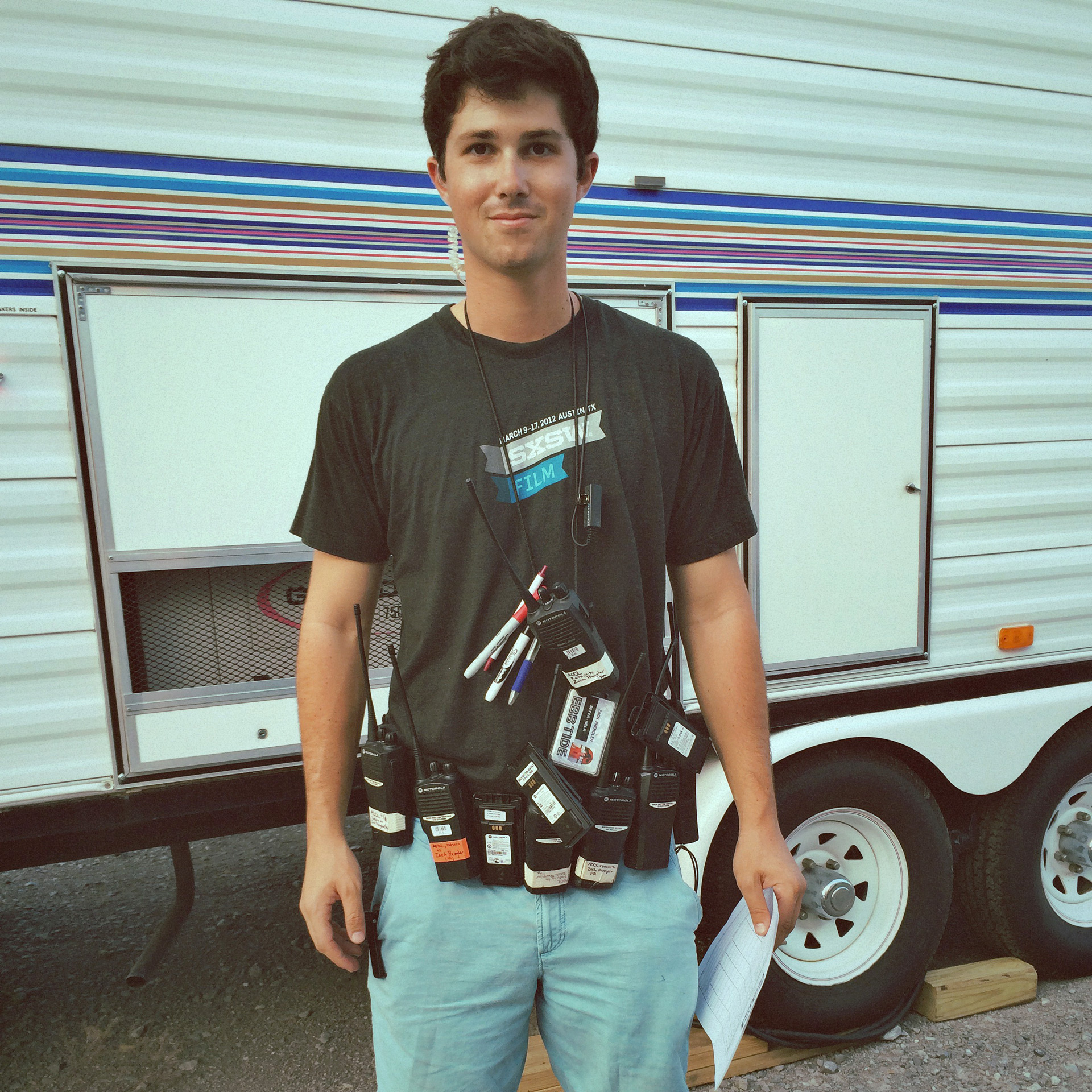 Zach Prengler with belt full of walkie talkies on set of Jurassic World