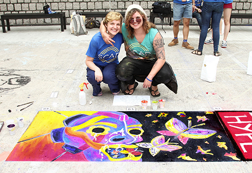 Mairin Blaauw and Maddalena DeBeni show off their sidewalk art