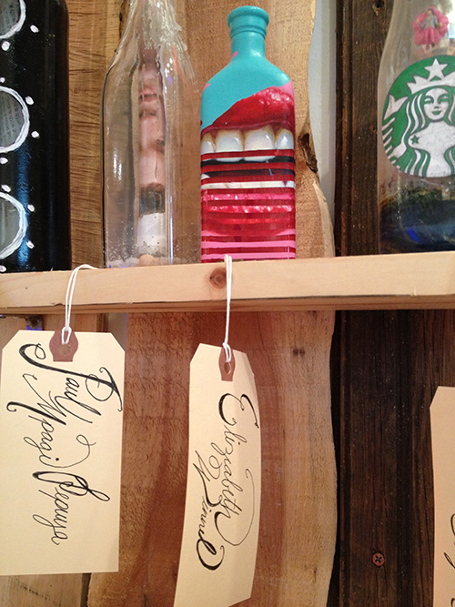 Detail of bottles on shelf with tags