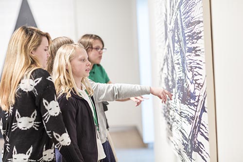 Students point out detail in artwork