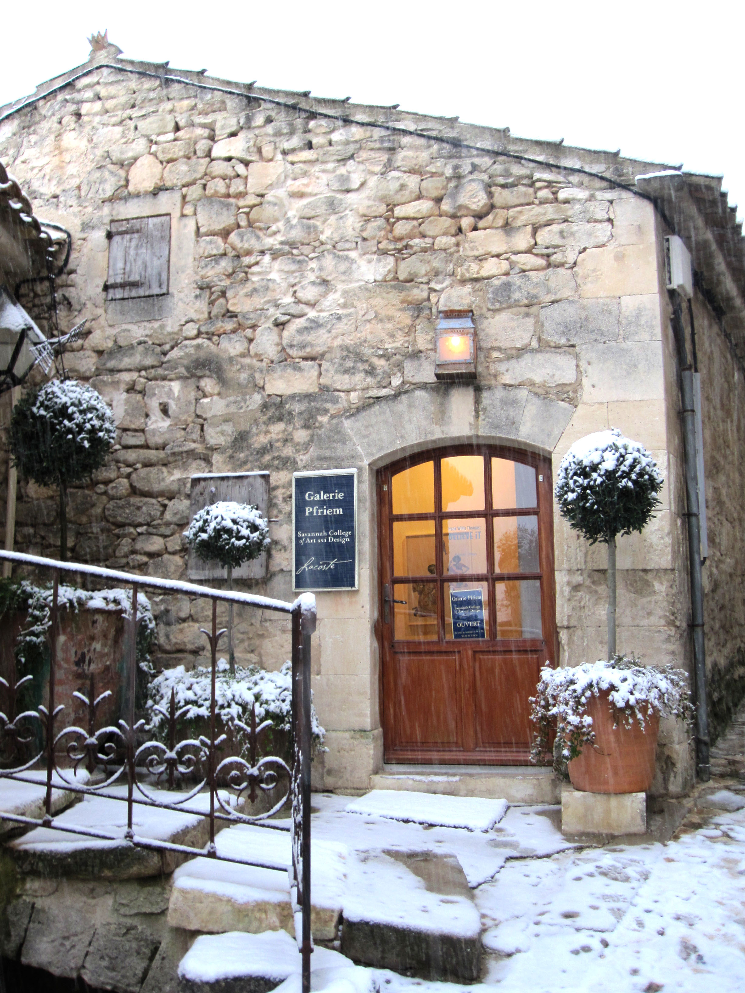 Snow dusts a building in Lacoste, France
