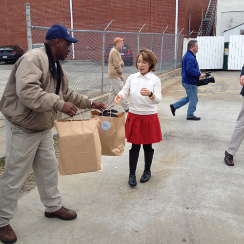 SCAD President Paula Wallce helps gather secret Santa gifts