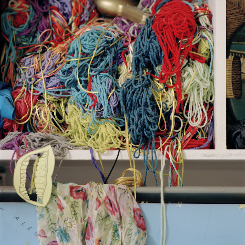 Bundle of different color yarn on a shelf in the Domestic Construction studio