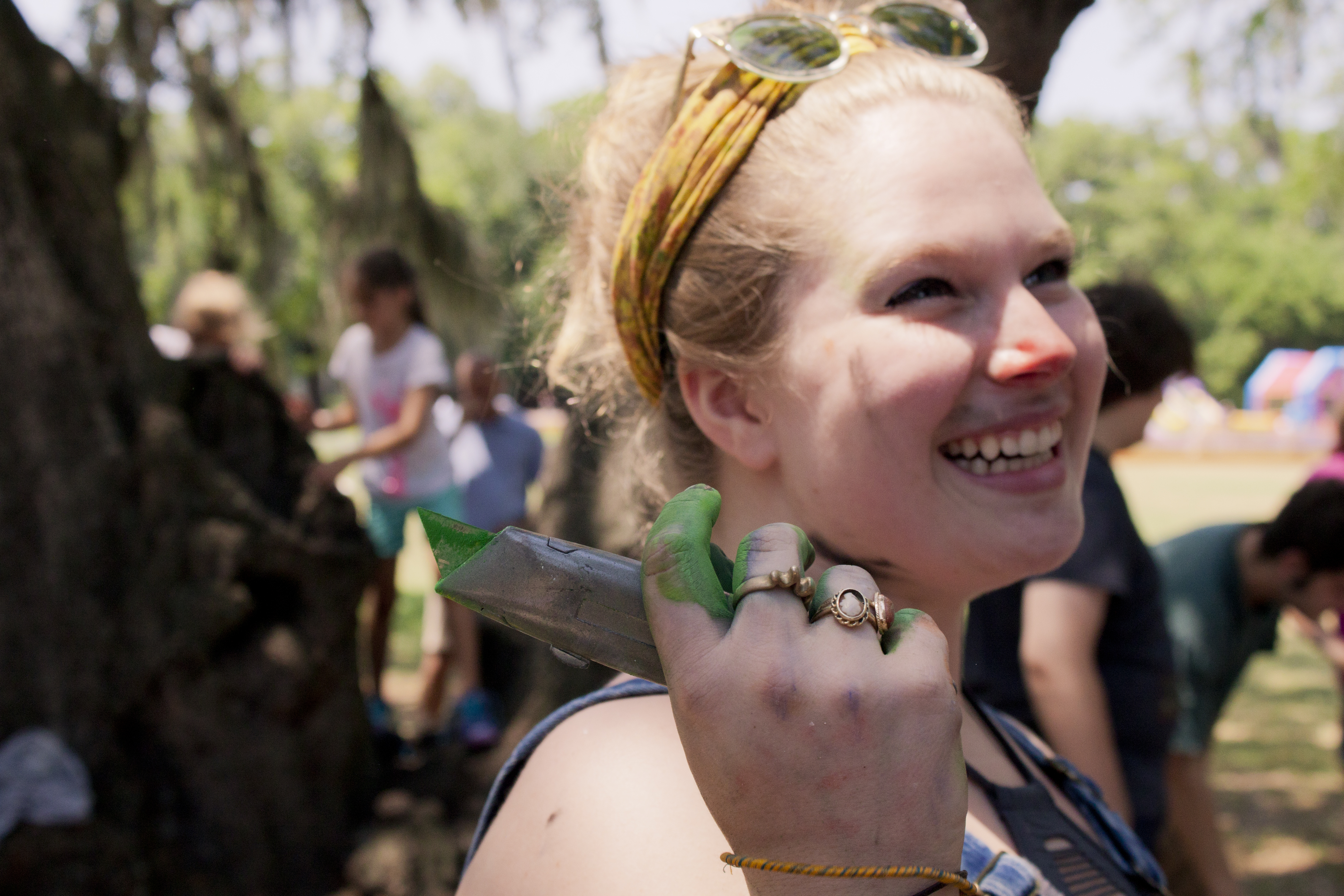 Participant smiles with chalk on her face