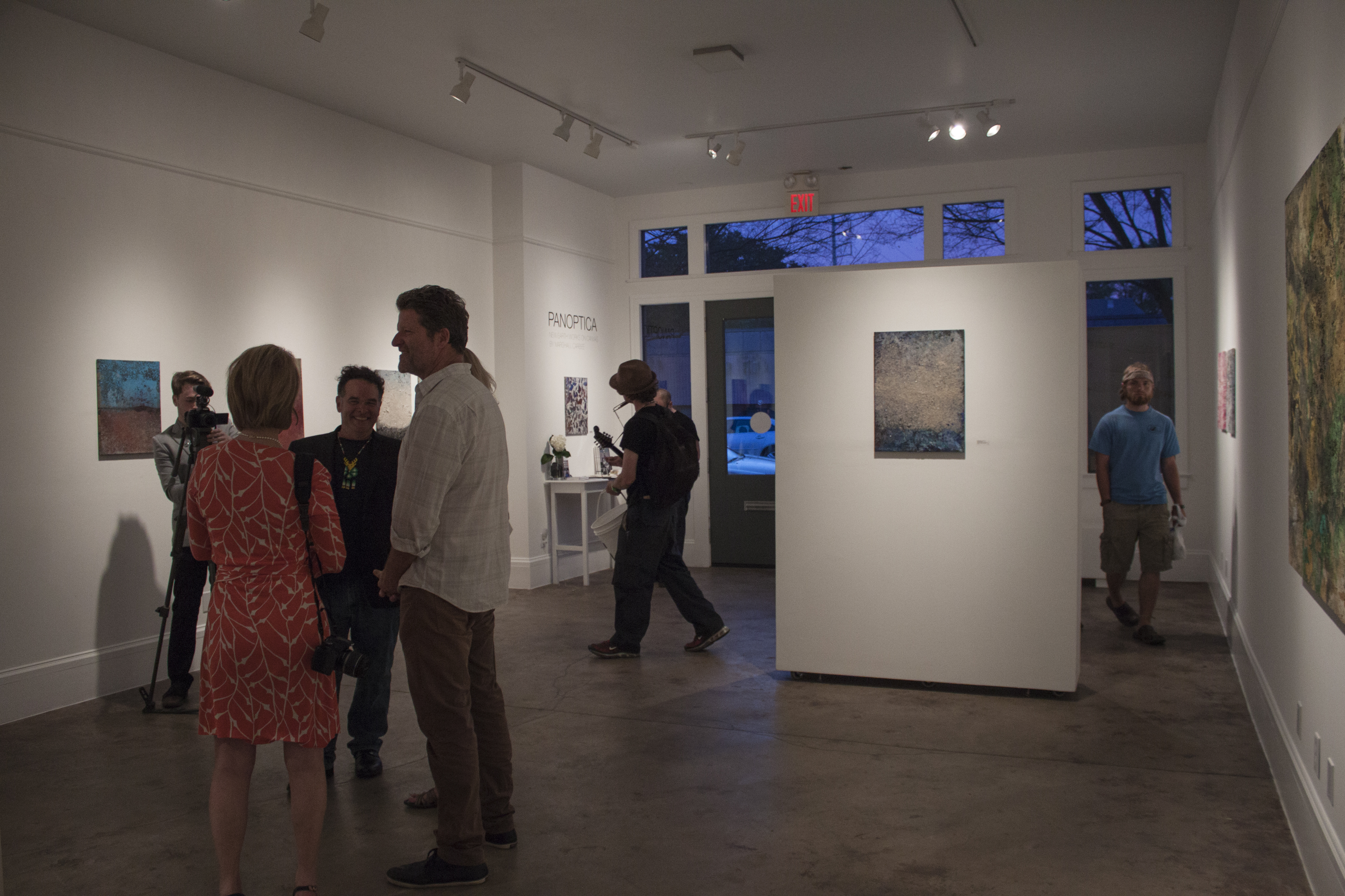 Marshall Carbee discussing his work in gallery