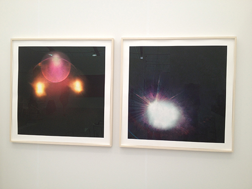 Two pieces of artwork hung on gallery wall