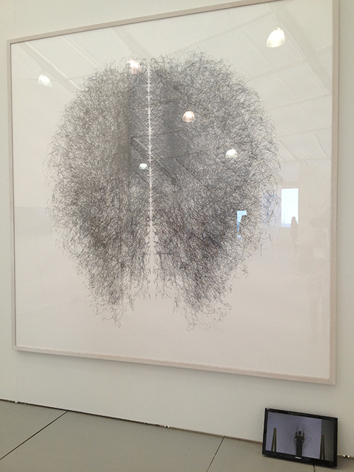 Large artwork hung on gallery wall