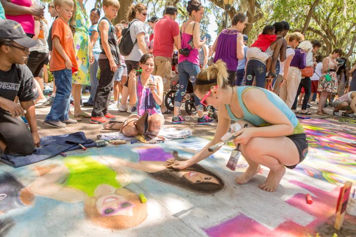 87331SCAD students creating chalk designs at Sidewalk Arts Festival